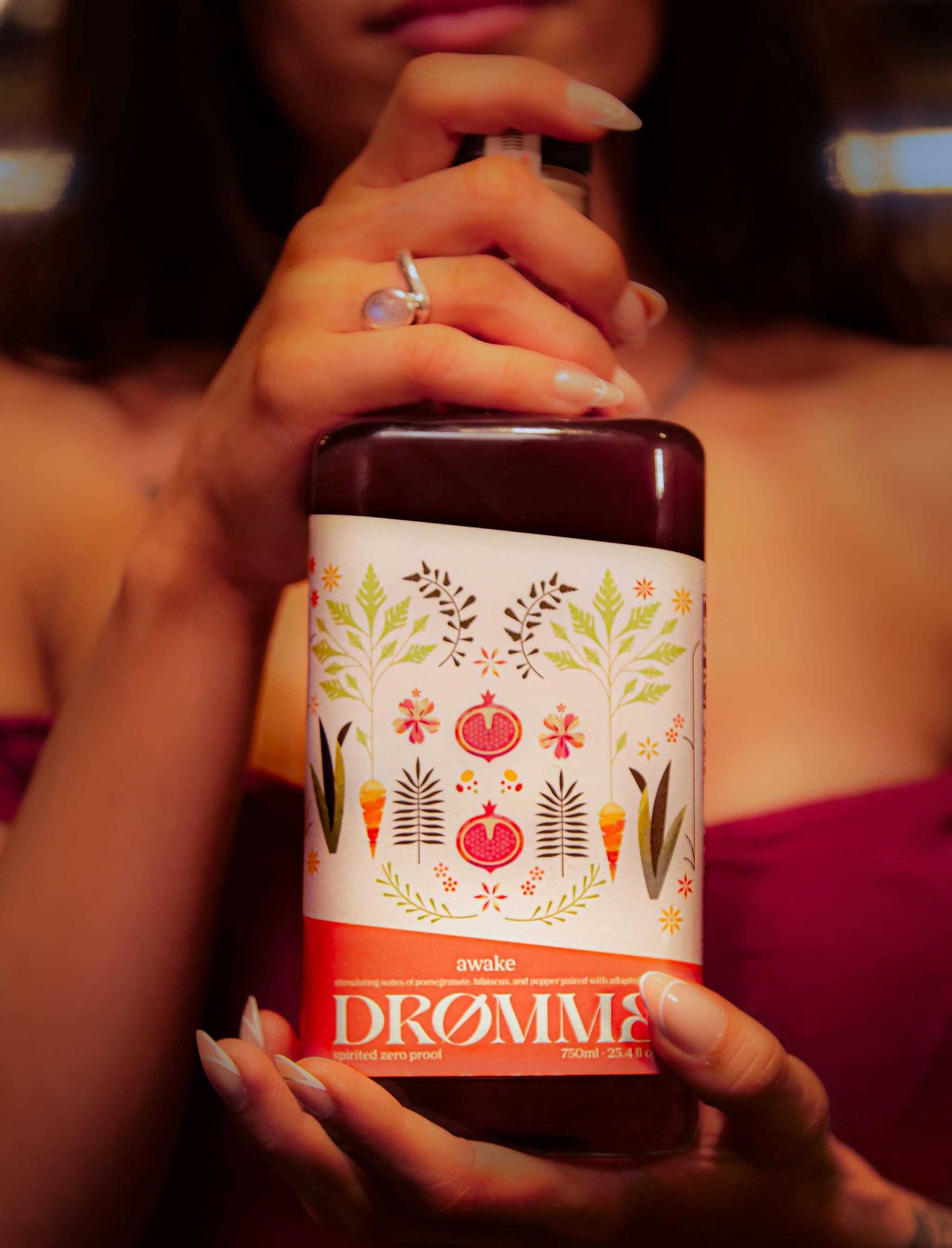 Drømme Awake zero proof elixir with pomegranate, hibiscus, and adaptogens for energy and focus