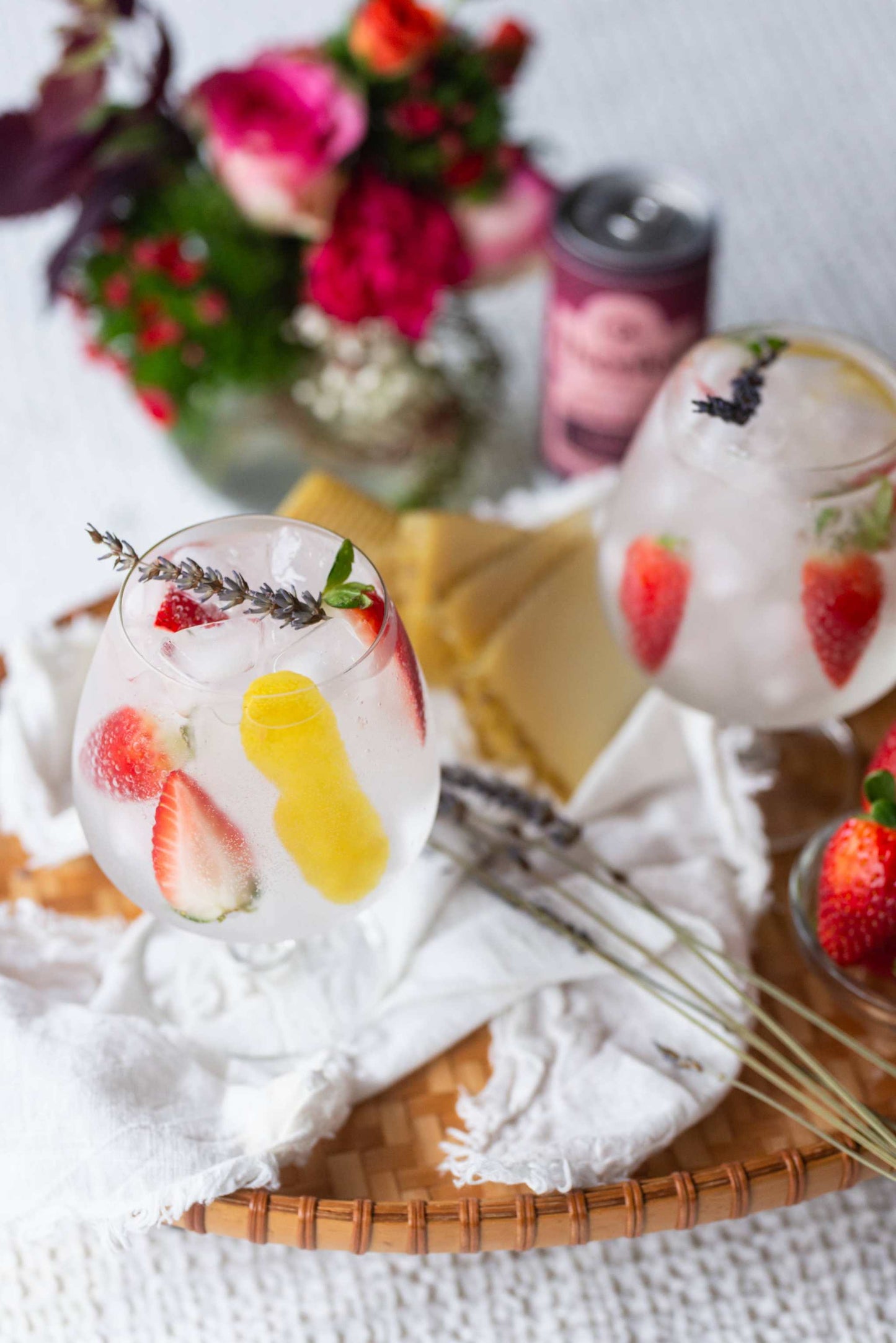 Bottle of handcrafted floral tonic water with botanical ingredients and citrus garnish
